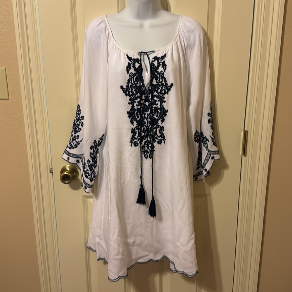 Pretty white dress with navy blue embroidery and long sleeves